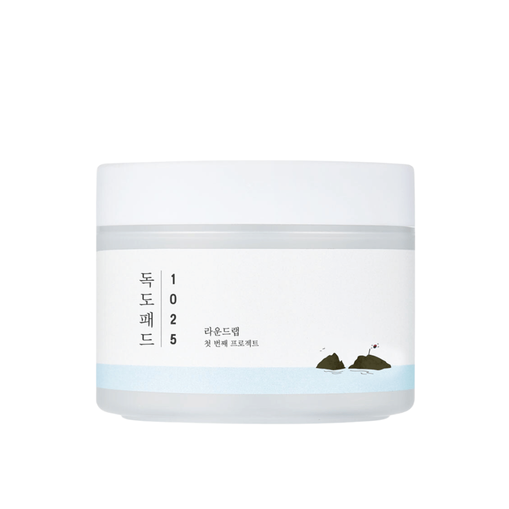 En lukket hvit boks med 1025 Dokdo Pads med et enkelt design og havmotiv på etiketten, mot en hvit bakgrunn.