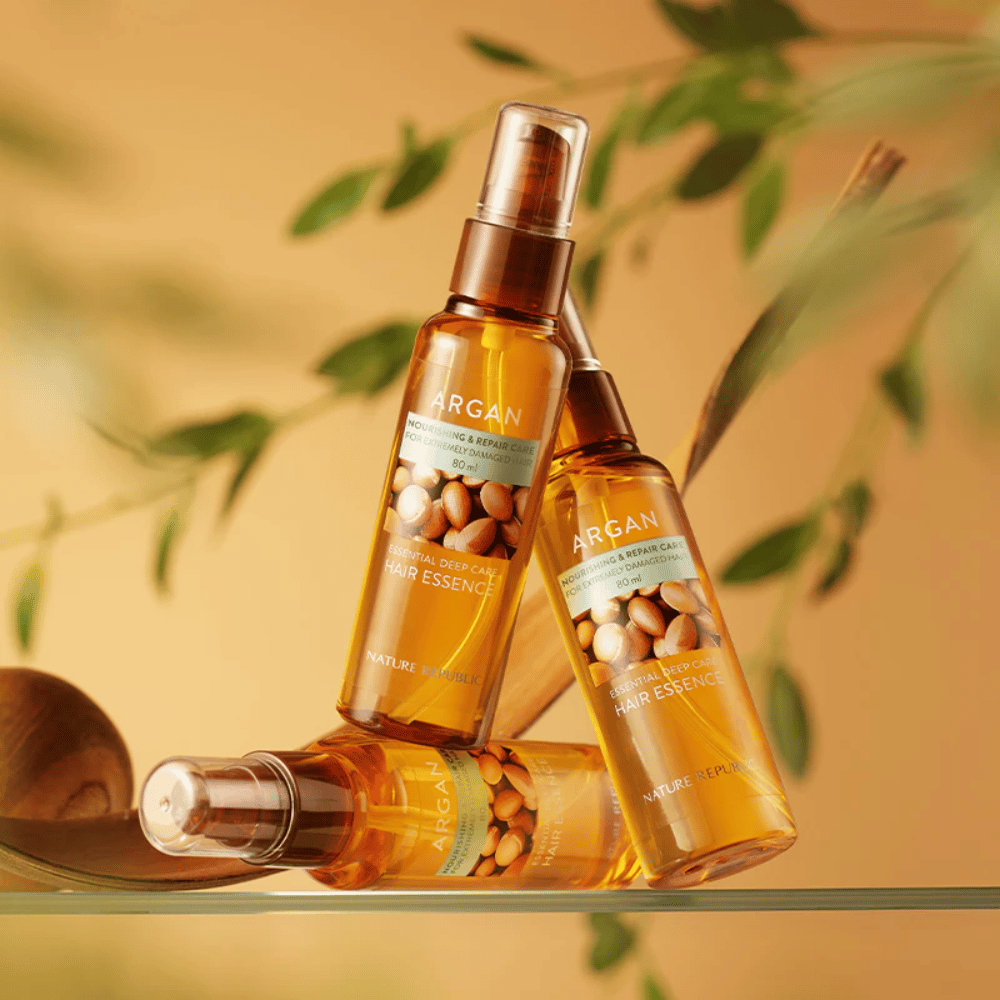 Tre flasker av Nature Republic Argan Essential Moisture Hair Oil med arganolje – gir næring, glans og reparerer skadet hår.