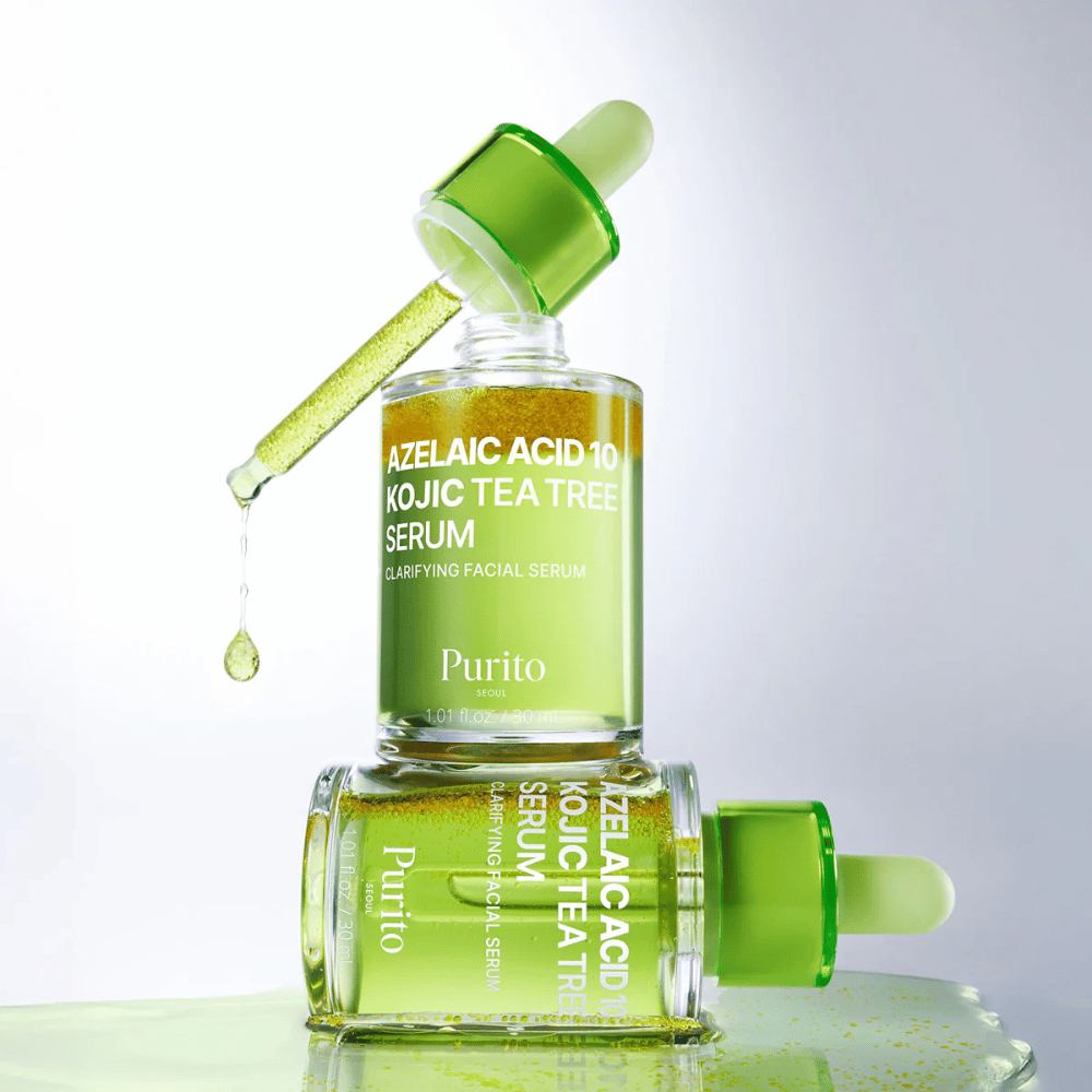 Purito Azelaic Acid 10 Kojic Tea Tree Serum – frisk grønn formel med dråpe fra pipette som viser serumets lette tekstur.