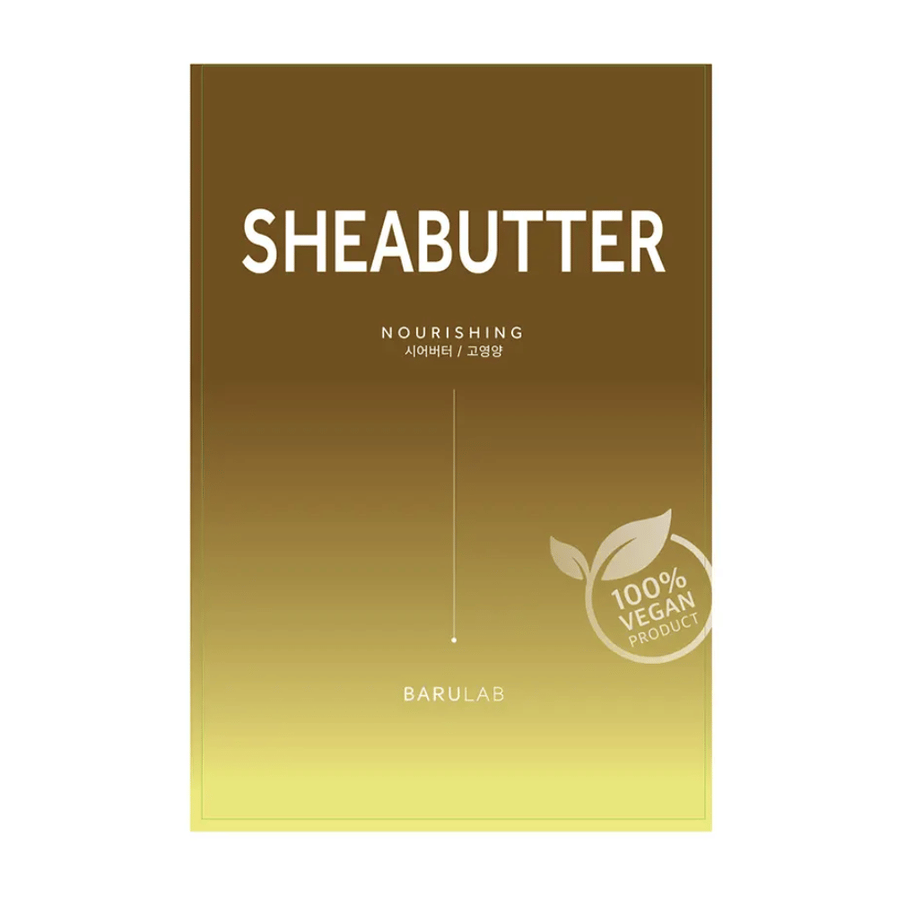 En pakke med BARULAB "SHEABUTTER Nourishing" maske, merket som "100% Vegan Product". Pakken har en fargegradient som går fra mørk gullbrun øverst til lys gul nederst.