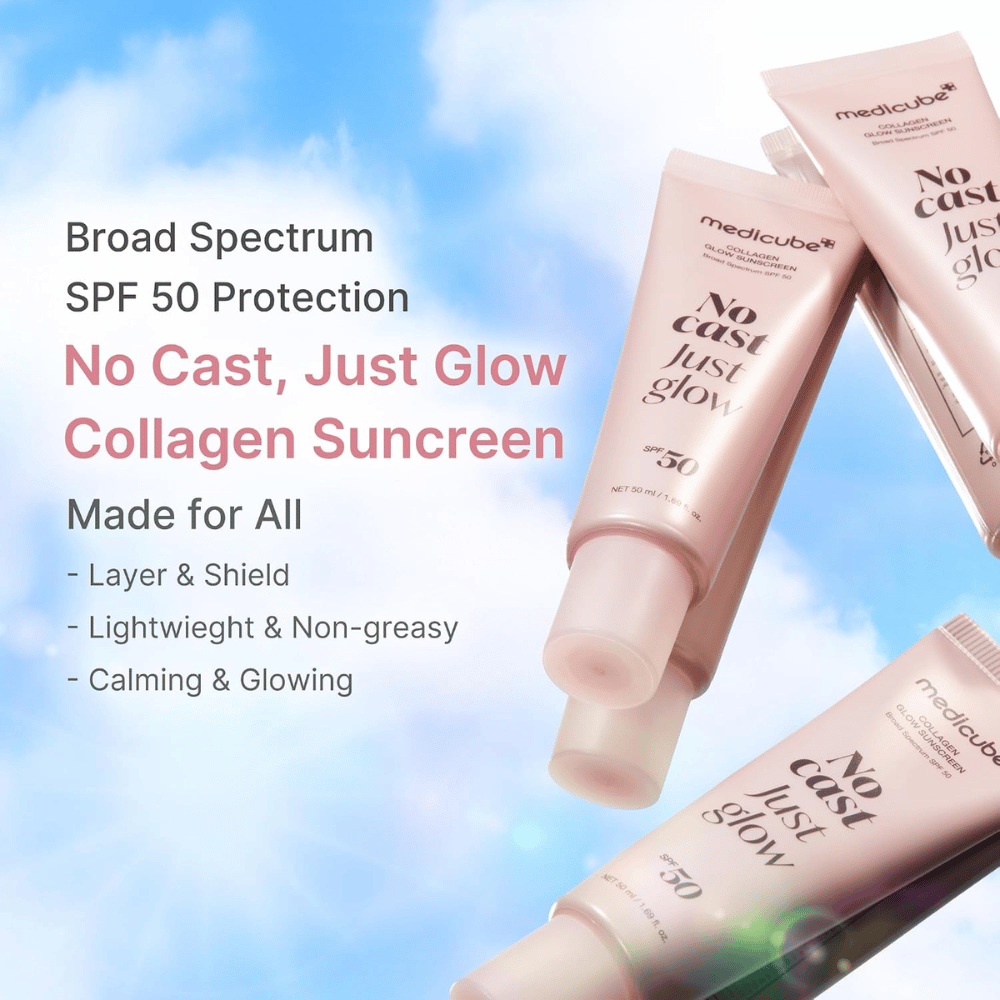 Medicube Collagen Glow Sunscreen SPF 50, lett solbeskyttelse med glow-effekt uten hvit hinne. Rosa solbeskyttelsestuber mot en blå himmel.