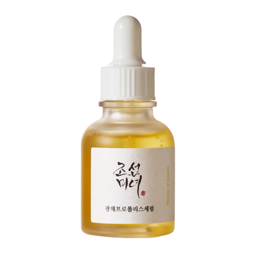 Flaske av Beauty of Joseon Glow Serum med hvit pipette og gullfarget serum, en glødgivende produkt med propolis og niacinamid.