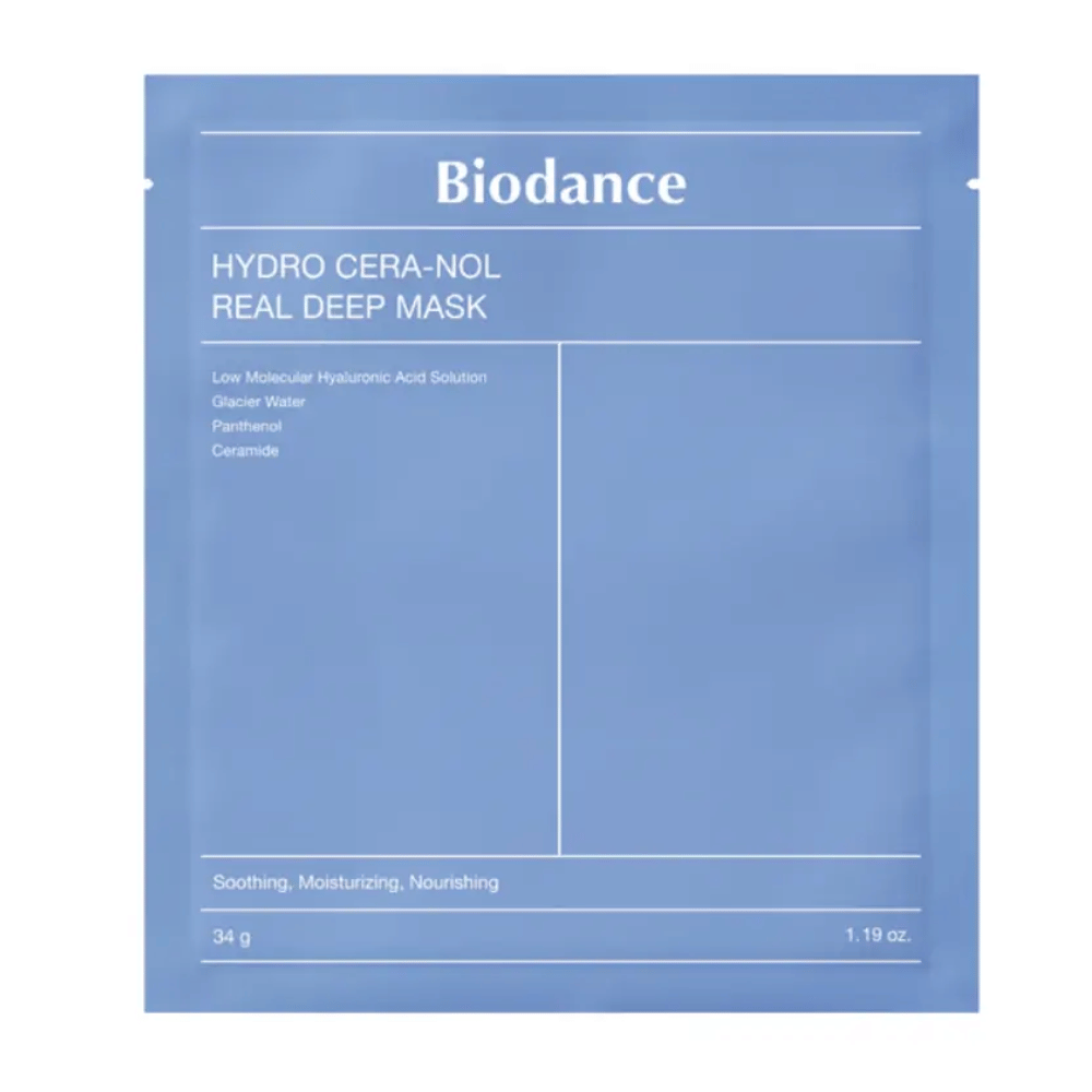Forpakningen viser "Biodance Hydro Cera-Nol Real Deep Mask". Det er en beroligende, fuktighetsgivende og nærende ansiktsmaske som inneholder lavmolekylær hyaluronsyre, brevann, panthenol og ceramider. Designen er enkel i en beroligende blå fargetone.