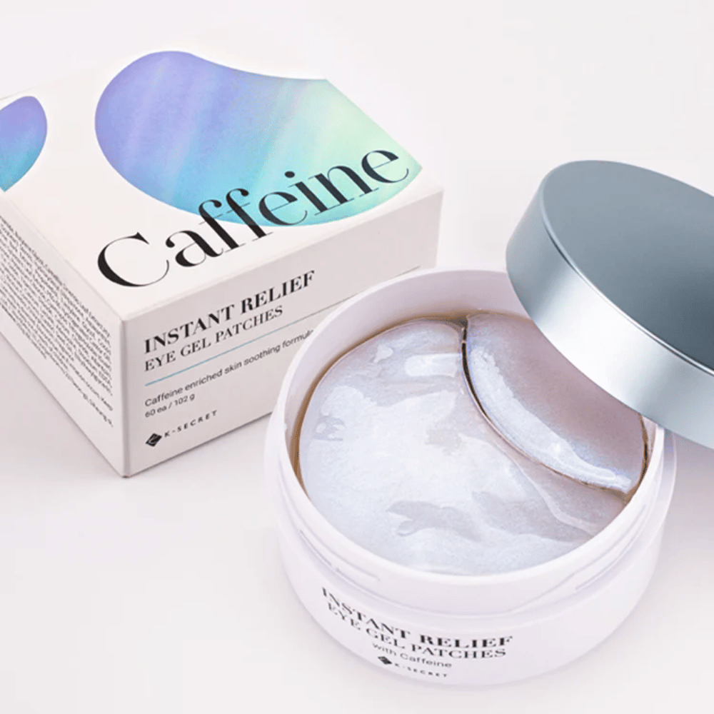 Boks og pakke av K-Secret Instant Relief Eye Gel Patches med koffein, åpnet og viser skimrende hydrogel-pads.