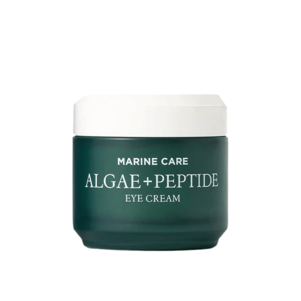 Heimish Marine Care Algae + Peptide Eye Cream i en mørkegrønn boks med hvitt lokk. En øyekrem beriket med alger og peptider for å fukte, lysne opp og redusere fine linjer rundt øynene.