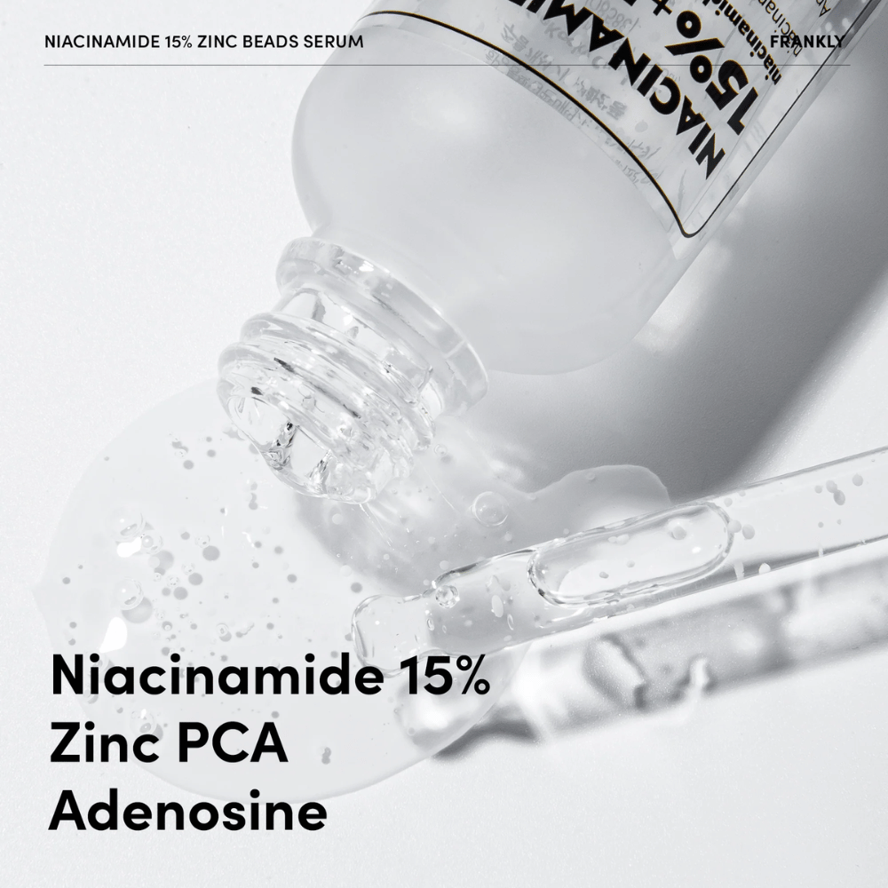 Nærbilde av FRANKLY Niacinamide 15% + Zinc Beads Serum som helles ut. Tekst viser ingredienser: Niacinamide 15 %, Zinc PCA og Adenosine.