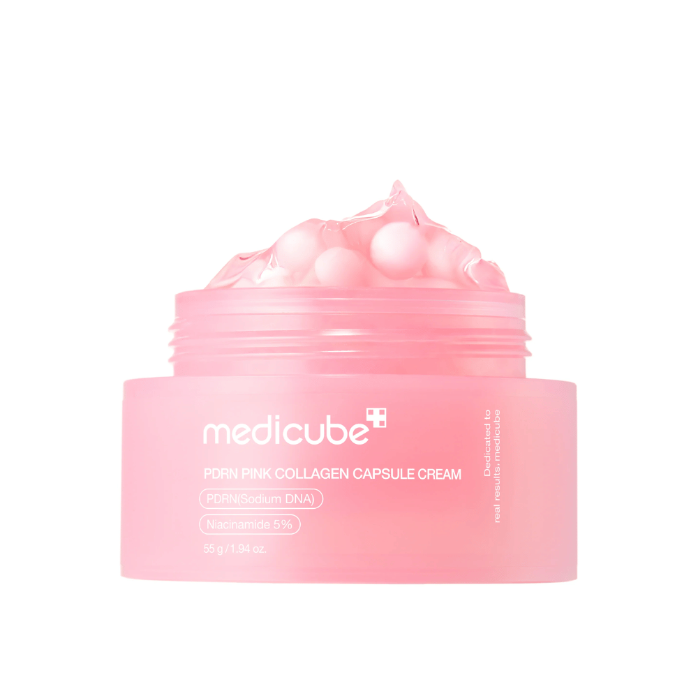 Produktbilde av Medicube PDRN Pink Collagen Capsule Cream med synlige rosa kapsler i en gjennomsiktig rosa krukke, designet for å fukte og jevne ut hudtonen.
