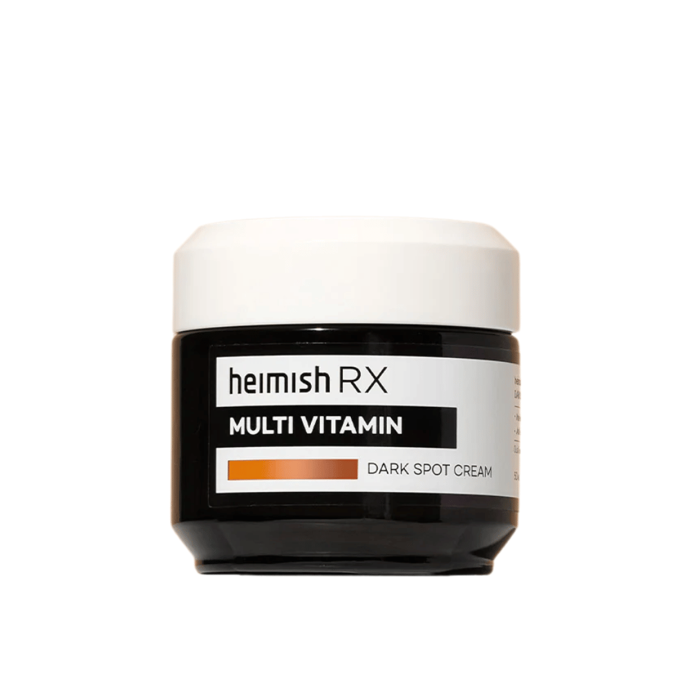 Heimish RX Multi Vitamin Dark Spot Cream i en stilren svart boks med hvitt lokk. En ansiktskrem beriket med multivitaminer, utviklet for å redusere mørke flekker og jevne ut hudtonen.