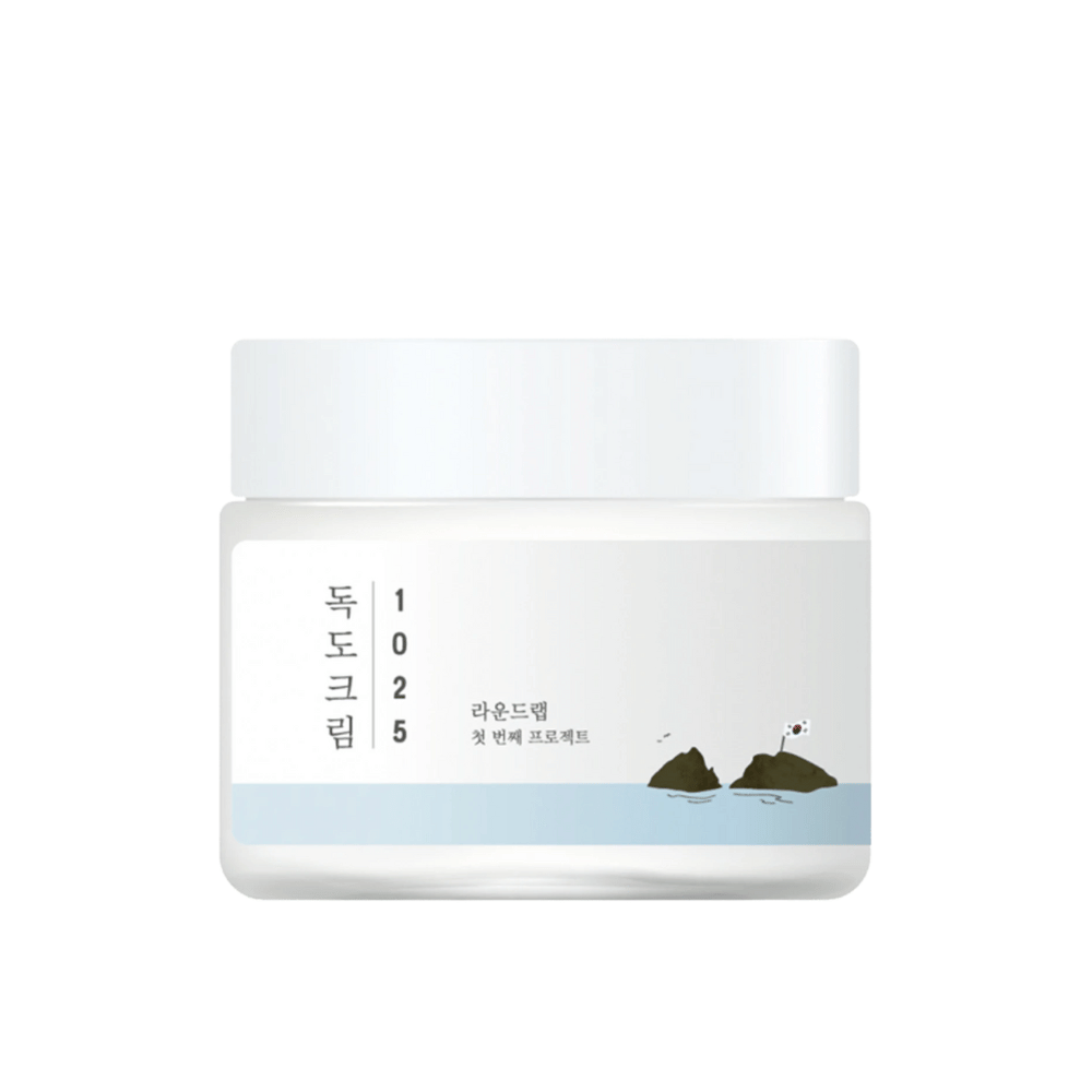 En krukke med Round Lab 1025 Dokdo Cream 80ml for fuktighet på hvit bakgrunn.