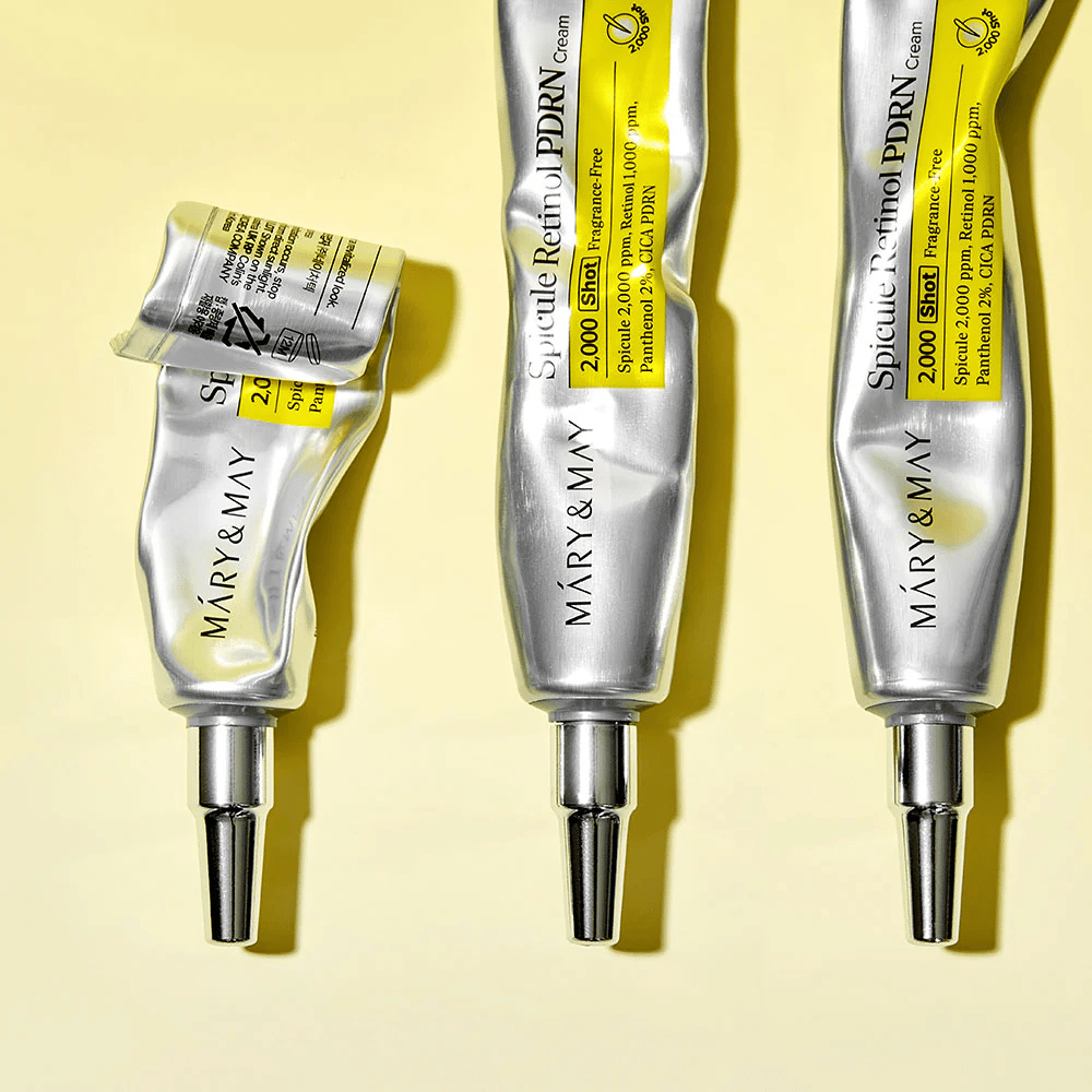 MARY & MAY Spicule Retinol PDRN Cream med synlig bruk i tube, viser kremens konsistens og rettet applikator for presis påføring på huden.