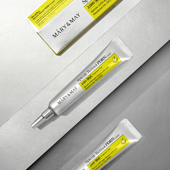 MARY & MAY Spicule Retinol PDRN Cream i tube og emballasje på lys bakgrunn, en aktiv ansiktskrem med retinol, spicule-teknologi og PDRN for forbedret hudstruktur og hudfornyelse.