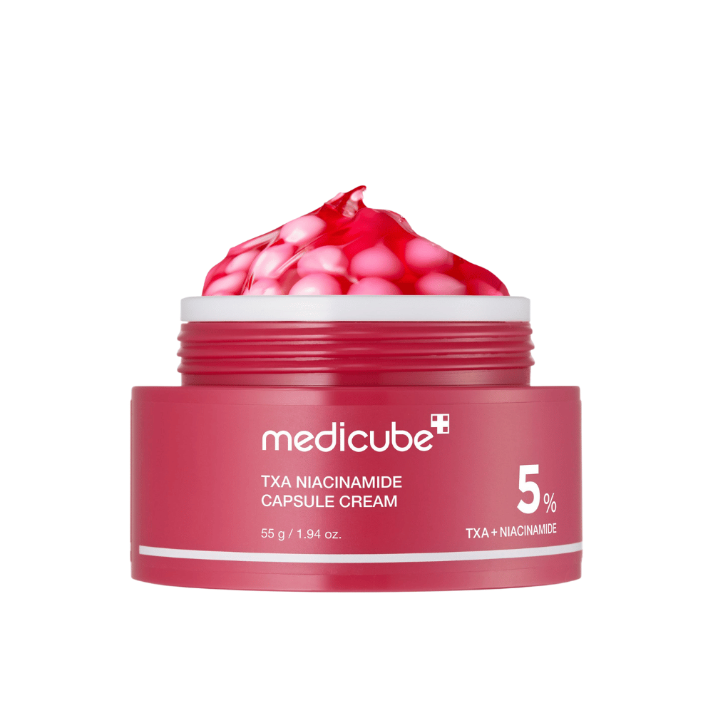 Medicube TXA Niacinamide Capsule Cream i boks med rosa kapsler i geleform, som viser tydelig produktmerking med 5 % TXA + Niacinamide.