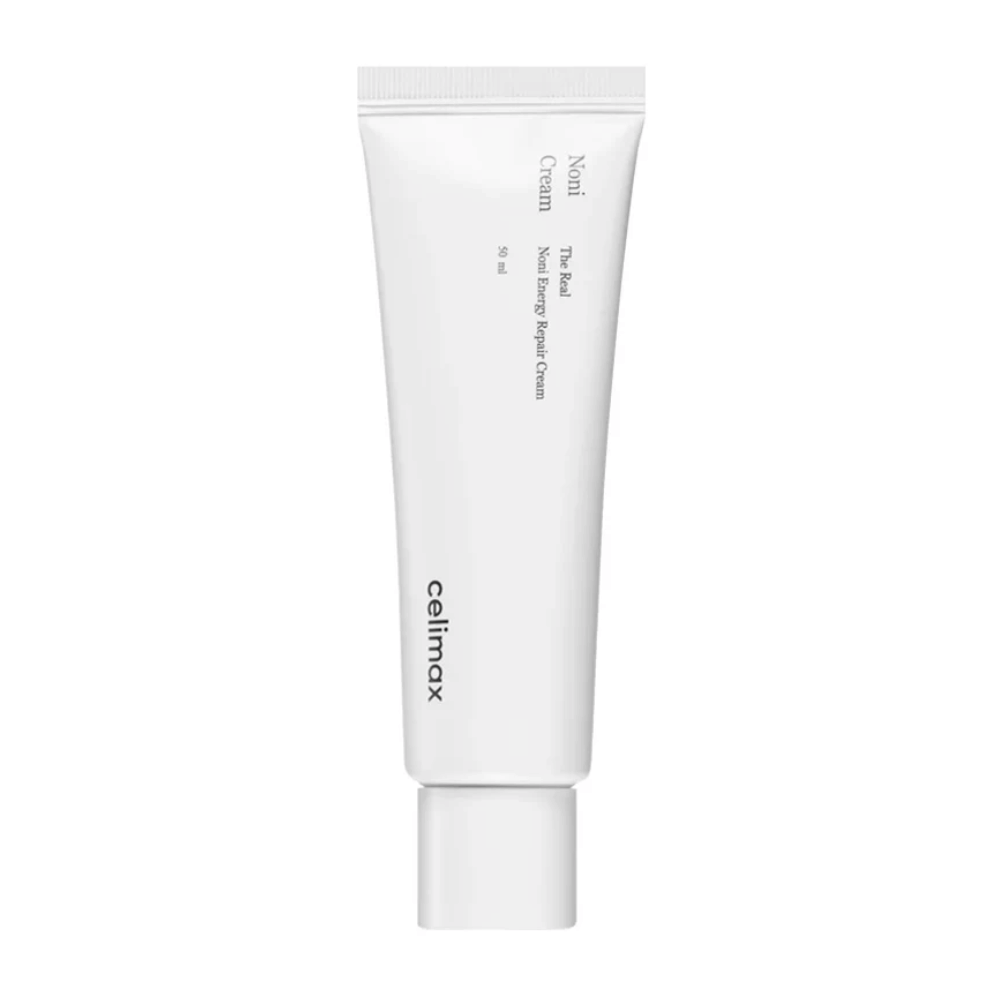 Celimax Noni Energy Repair Cream i en hvit tube med svart tekst. Produktet er merket som "The Real Noni Energy Repair Cream" og har et volum på 50 ml.