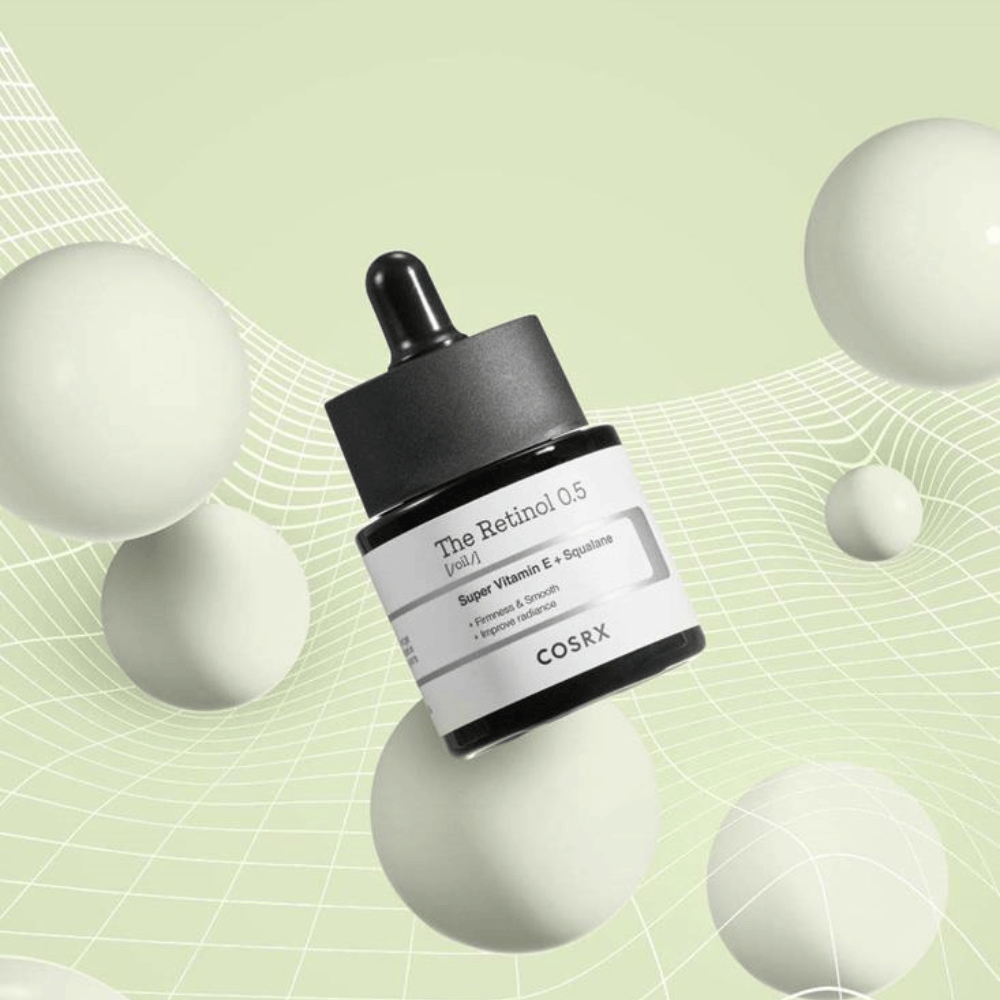 En flaske COSRX Retinol 0.5 Oil 20ml som fremmer anti-aging fordeler på en hvit bakgrunn.