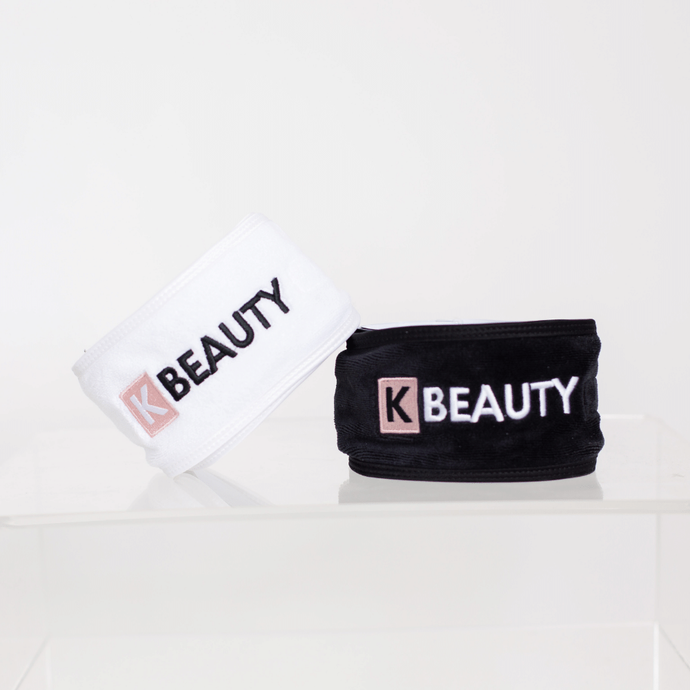 To K-Beauty Makeup Pannebånd med ordet "skjønnhet" på.